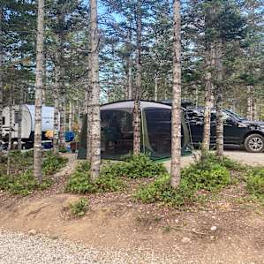 Our site. Trailer, screened room and our truck a RTT.