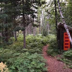 Even the outhouse is charming.