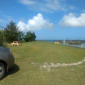 The "peninsula" with chairs for sunrise viewing and picnic tables.