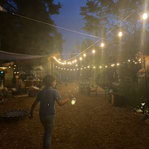 The farm’s communal space covered in fairy lights.