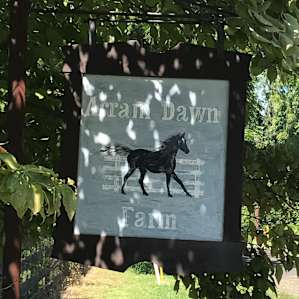 At entrance to farm driveway
