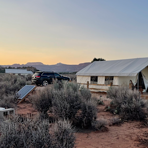Cool solar panels and our car with the Powell Tent!