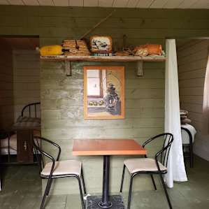 Little spot to eat, study, create, or play a game. Even a crib board and cards on the shelf above for a rainy day.