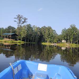 Facing the stage and dock.