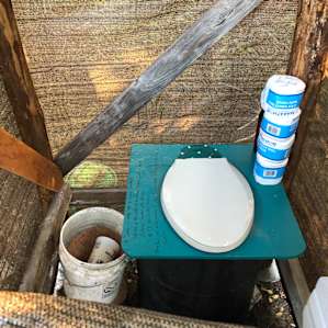 Clean composting toilet with all that you need and instructions