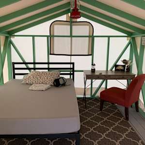 Cute interior! Lots of natural light. 3 windows that can be unzipped if you need a breeze. They provide a fitted sheet. Foam mattress super comfy!