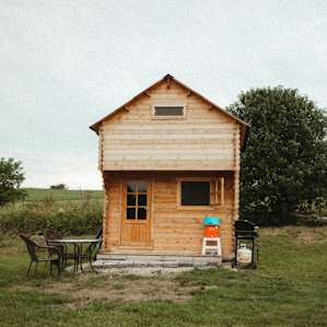 The bunkie is well designed for a small group and Angie also made space for outdoor seating just beyond the porch.