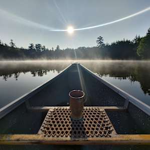 Early morning canoeing. The pond was super still and the mist was beautiful.