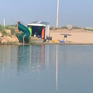 Trailer with all the canoes, kayaks, and paddle board.
Slide into the water