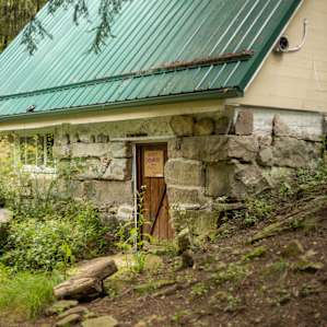 A neat stone foundation suggests a long history.