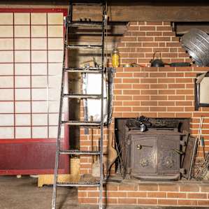 The sleeping area can be accessed via this cool old metal ladder.