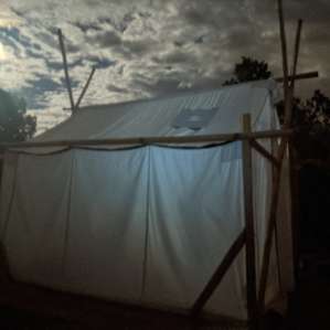 The tent under a full moon.
