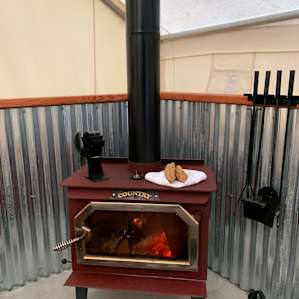 Warming the biscuits on the wood stove 😋