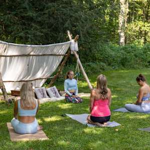 One of the hosts Dani, leading a yoga class
