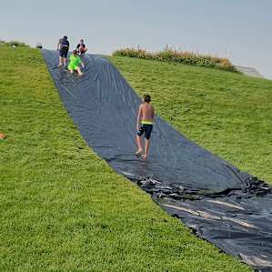 Saturday afternoon slip and slide down the grassy hill!