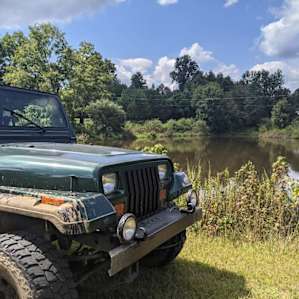 15 acres with a pond and a creek