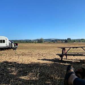 View from camp with their complimentary picnic table you can use. Great star watching from the field at night!