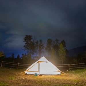 A night shot of the tent with some storm clouds rolling in. It rained that night but we were bone dry and warm :)