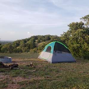Facing north, nice flat area to set up a tent.