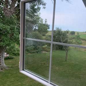 Looking out of the window of the room we stayed in due to rain.
