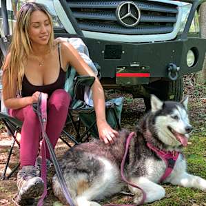 My wife and one of our Huskies.