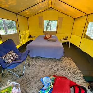 Wide angle view of interior of glamping tent
