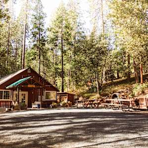 Main lodge where hosts stay. Filled with picnic table for large gatherings.