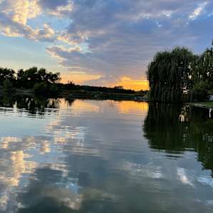 The private lake is beautiful at any time of the day or night.