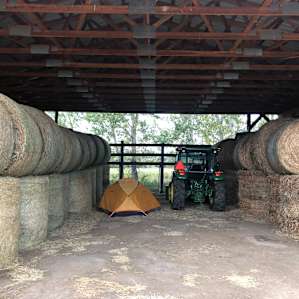 My sleeping quarters come with the sweetness of hay and a creek sound machine.