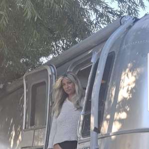 I guess boots a swimsuit, sweater and a airstream make for a smokin picture