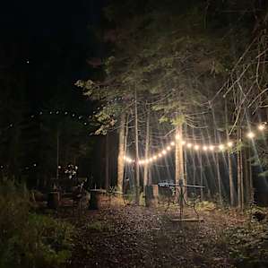 Adorable campfire area with tables, chairs, and more!