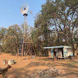 Camped under the windmill with meadow views all around.