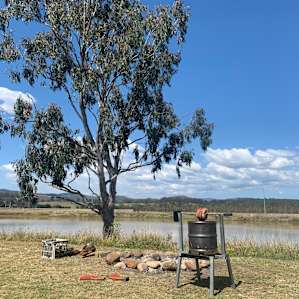 Spit Roast set up near dam what more do you need but to sit back, relax have a beer or wine.