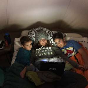 Cuddling together for a family movie before sleep