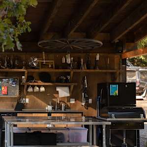 Fully functioning outdoor kitchen with a full size refrigerator.