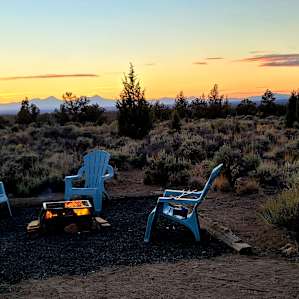 Sunset with the fire pit and sitting area