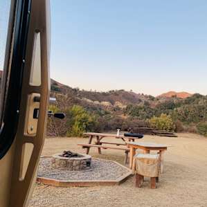 Here you can see the propane fire pit and picnic table you’ll find at each spot.