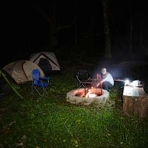 Roasting marshmallows over the fire.