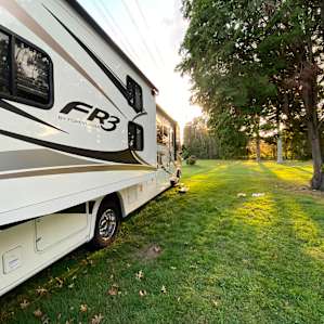 Grassy RV camping with trees