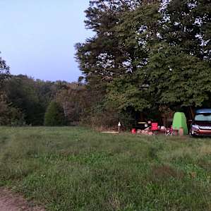 Our tent was attached to the car but this shows you the privacy we experienced. You might be able to see the pond through the woods.