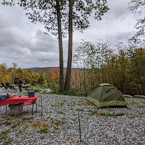 We had an airbed so we could put out tent anywhere. Rocks are not sharp and will not puncture your airbed.