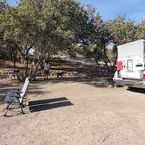 Campsite :) loved the shade and picnic table with map of property and trails.
