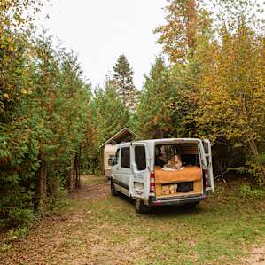 We drove our van into this parking area. This wooded area is what you'll see when you first pull into the campsite
