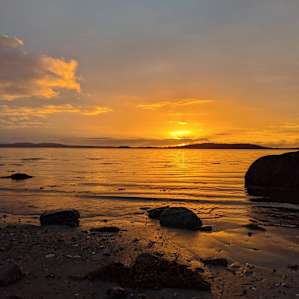 Watching the sunset on the beach by Lily's property