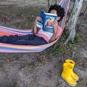 An explorer takes a break from independent exploration. As others have said, kids don't want to leave this magical place.
