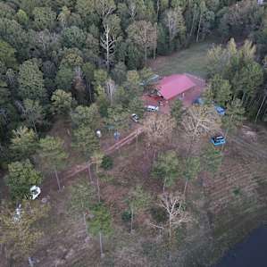Red entrance barn, showing site 1 (next to barn) and site 2 (white car)