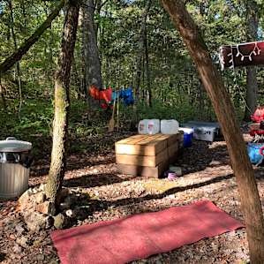 Great set up with table, some wood boxes for use as well, and lots of fire wood ready for use.