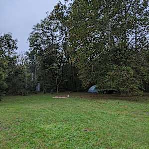 Porta-potty and firewood shed across the field. Bundle of firewood is $5 cash.
