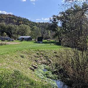 Scenic creek with rolling hills