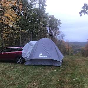 Car camping with privacy and a great view. The picnic table and fire circle hidden by our car